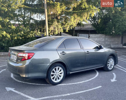 Зелений Тойота Камрі, об'ємом двигуна 2.49 л та пробігом 259 тис. км за 13000 $, фото 3 на Automoto.ua