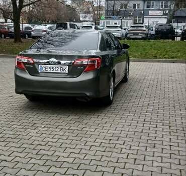 Зеленый Тойота Камри, объемом двигателя 2.5 л и пробегом 230 тыс. км за 11300 $, фото 7 на Automoto.ua