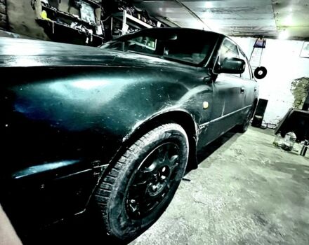 Зеленый Тойота Камри, объемом двигателя 3 л и пробегом 235 тыс. км за 2800 $, фото 1 на Automoto.ua