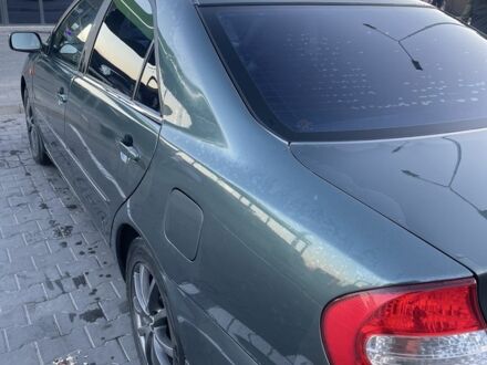 Зеленый Тойота Камри, объемом двигателя 3 л и пробегом 384 тыс. км за 7300 $, фото 1 на Automoto.ua