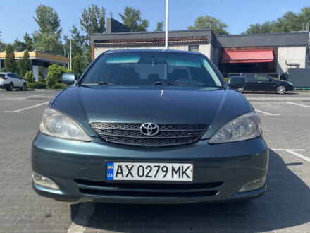 Зеленый Тойота Камри, объемом двигателя 2.4 л и пробегом 256 тыс. км за 6000 $, фото 1 на Automoto.ua