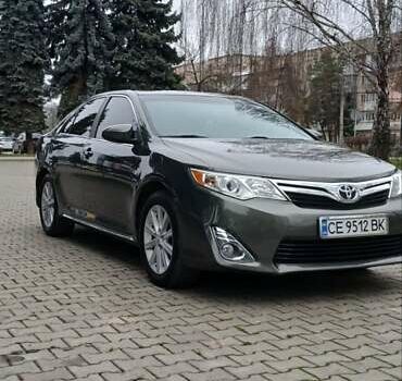 Зеленый Тойота Камри, объемом двигателя 2.5 л и пробегом 230 тыс. км за 11300 $, фото 1 на Automoto.ua