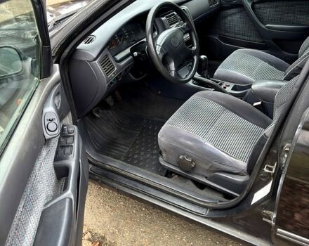Черный Тойота Карина, объемом двигателя 1.8 л и пробегом 210 тыс. км за 1799 $, фото 6 на Automoto.ua