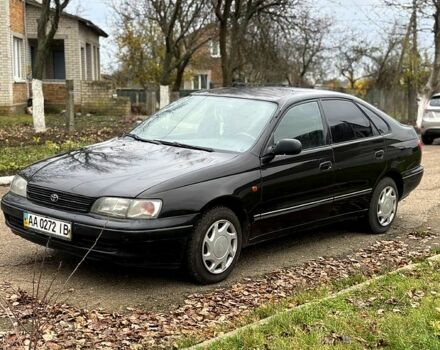Черный Тойота Карина, объемом двигателя 1.8 л и пробегом 210 тыс. км за 1799 $, фото 2 на Automoto.ua