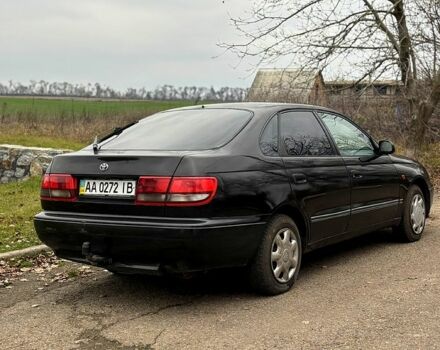 Черный Тойота Карина, объемом двигателя 1.8 л и пробегом 210 тыс. км за 1799 $, фото 4 на Automoto.ua