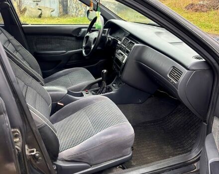 Черный Тойота Карина, объемом двигателя 1.8 л и пробегом 210 тыс. км за 1799 $, фото 7 на Automoto.ua