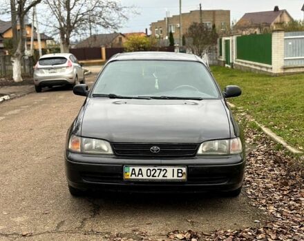 Черный Тойота Карина, объемом двигателя 1.8 л и пробегом 210 тыс. км за 1799 $, фото 1 на Automoto.ua