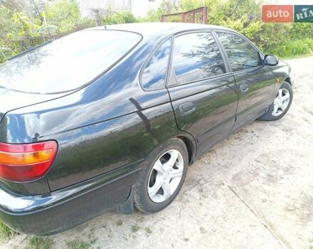 Черный Тойота Карина, объемом двигателя 1.76 л и пробегом 293 тыс. км за 2650 $, фото 2 на Automoto.ua