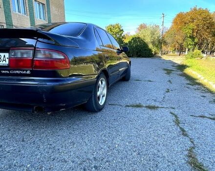 Черный Тойота Карина, объемом двигателя 2 л и пробегом 325 тыс. км за 2700 $, фото 1 на Automoto.ua