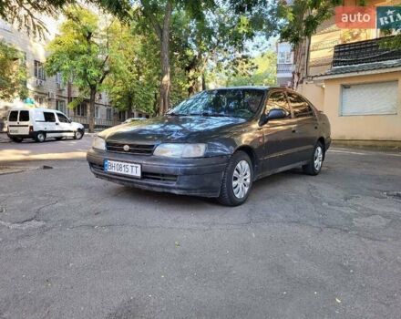 Чорний Тойота Каріна, об'ємом двигуна 1.6 л та пробігом 587 тис. км за 1550 $, фото 1 на Automoto.ua