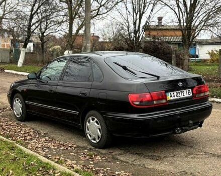 Черный Тойота Карина, объемом двигателя 1.8 л и пробегом 210 тыс. км за 1799 $, фото 1 на Automoto.ua