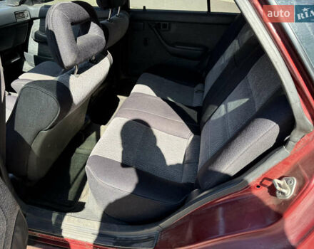 Красный Тойота Карина, объемом двигателя 2 л и пробегом 333 тыс. км за 1375 $, фото 9 на Automoto.ua