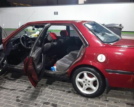 Красный Тойота Карина, объемом двигателя 2 л и пробегом 350 тыс. км за 1600 $, фото 1 на Automoto.ua