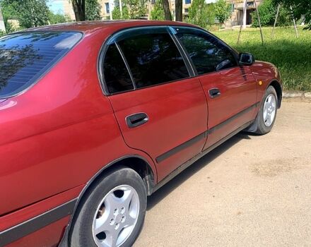 Червоний Тойота Каріна, об'ємом двигуна 1.6 л та пробігом 20 тис. км за 2500 $, фото 1 на Automoto.ua