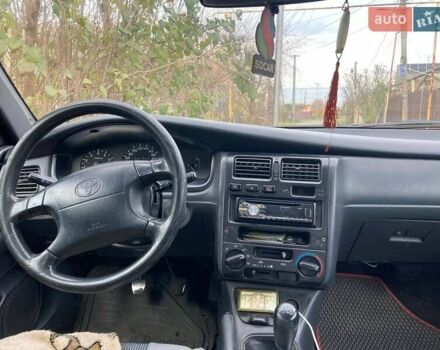 Красный Тойота Карина, объемом двигателя 1.76 л и пробегом 428 тыс. км за 2800 $, фото 3 на Automoto.ua