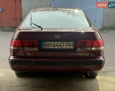 Красный Тойота Карина, объемом двигателя 1.6 л и пробегом 259 тыс. км за 2800 $, фото 4 на Automoto.ua