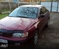 Красный Тойота Карина, объемом двигателя 1.6 л и пробегом 167 тыс. км за 1600 $, фото 1 на Automoto.ua