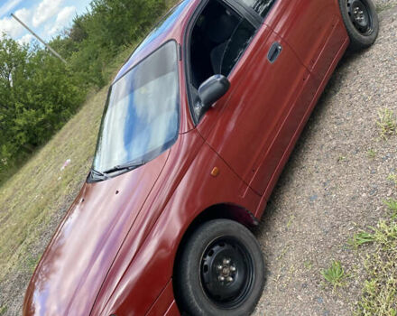 Червоний Тойота Каріна, об'ємом двигуна 1.6 л та пробігом 260 тис. км за 2100 $, фото 1 на Automoto.ua