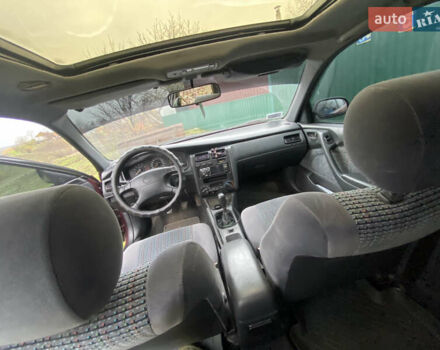 Червоний Тойота Каріна, об'ємом двигуна 1.6 л та пробігом 260 тис. км за 2100 $, фото 4 на Automoto.ua