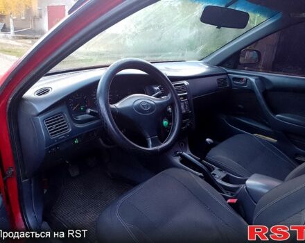 Червоний Тойота Каріна, об'ємом двигуна 1.6 л та пробігом 111 тис. км за 1999 $, фото 5 на Automoto.ua