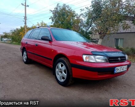Червоний Тойота Каріна, об'ємом двигуна 1.6 л та пробігом 111 тис. км за 1999 $, фото 1 на Automoto.ua