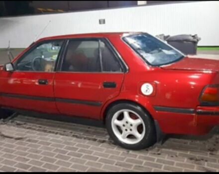 Красный Тойота Карина, объемом двигателя 2 л и пробегом 350 тыс. км за 1600 $, фото 1 на Automoto.ua