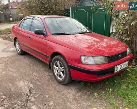 Красный Тойота Карина, объемом двигателя 1.76 л и пробегом 428 тыс. км за 2800 $, фото 1 на Automoto.ua