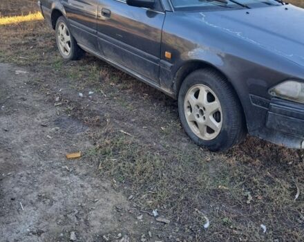 Серый Тойота Карина, объемом двигателя 1.6 л и пробегом 2 тыс. км за 800 $, фото 1 на Automoto.ua