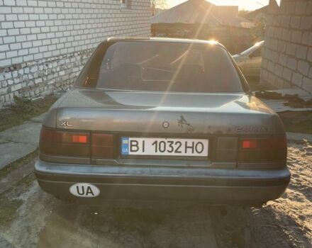 Серый Тойота Карина, объемом двигателя 1.6 л и пробегом 500 тыс. км за 600 $, фото 1 на Automoto.ua