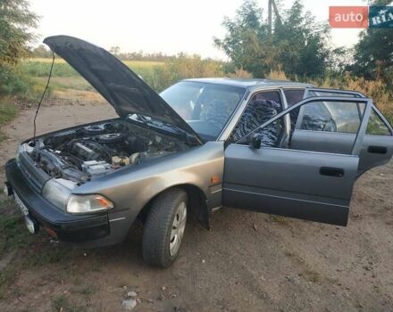 Серый Тойота Карина, объемом двигателя 1.59 л и пробегом 185 тыс. км за 1800 $, фото 1 на Automoto.ua