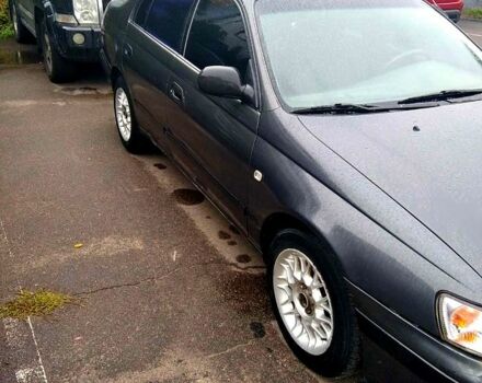 Серый Тойота Карина, объемом двигателя 2 л и пробегом 350 тыс. км за 1300 $, фото 1 на Automoto.ua