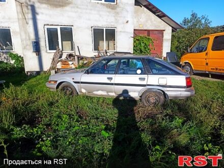 Серый Тойота Карина, объемом двигателя 1.6 л и пробегом 230 тыс. км за 560 $, фото 1 на Automoto.ua