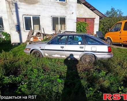 Серый Тойота Карина, объемом двигателя 1.6 л и пробегом 230 тыс. км за 560 $, фото 1 на Automoto.ua