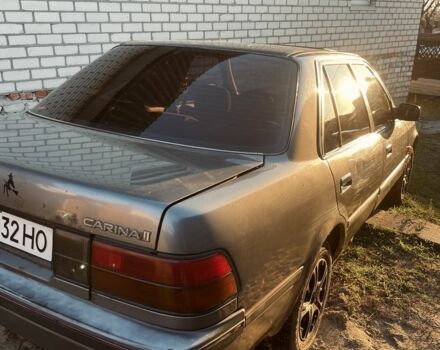 Серый Тойота Карина, объемом двигателя 1.6 л и пробегом 500 тыс. км за 600 $, фото 1 на Automoto.ua