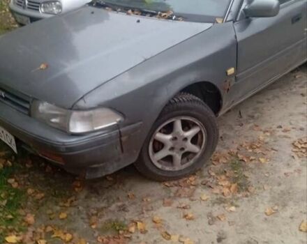 Серый Тойота Карина, объемом двигателя 1.6 л и пробегом 300 тыс. км за 700 $, фото 1 на Automoto.ua