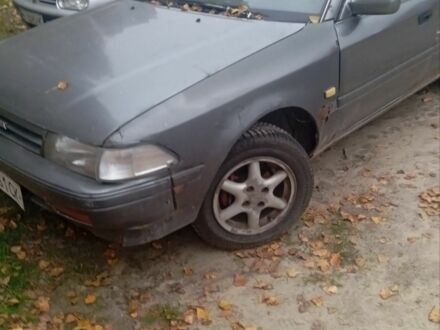 Серый Тойота Карина, объемом двигателя 1.6 л и пробегом 100 тыс. км за 700 $, фото 1 на Automoto.ua