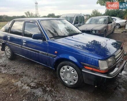 Синий Тойота Карина, объемом двигателя 2 л и пробегом 250 тыс. км за 900 $, фото 2 на Automoto.ua