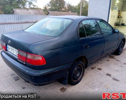 Синій Тойота Каріна, об'ємом двигуна 2 л та пробігом 200 тис. км за 1600 $, фото 4 на Automoto.ua