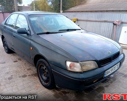 Синій Тойота Каріна, об'ємом двигуна 2 л та пробігом 200 тис. км за 1600 $, фото 1 на Automoto.ua