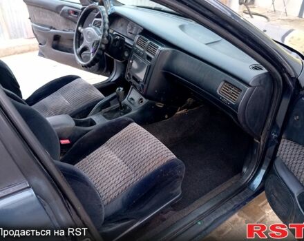 Синій Тойота Каріна, об'ємом двигуна 2 л та пробігом 200 тис. км за 1600 $, фото 11 на Automoto.ua