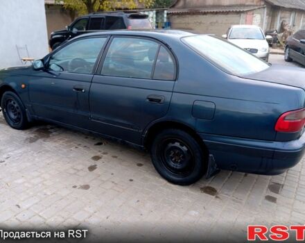Синій Тойота Каріна, об'ємом двигуна 2 л та пробігом 200 тис. км за 1600 $, фото 6 на Automoto.ua
