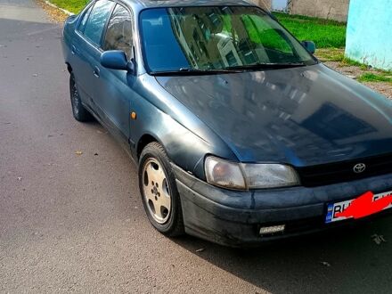 Синий Тойота Карина, объемом двигателя 2 л и пробегом 190 тыс. км за 1500 $, фото 1 на Automoto.ua