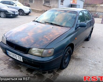 Синий Тойота Карина, объемом двигателя 2 л и пробегом 200 тыс. км за 1600 $, фото 1 на Automoto.ua