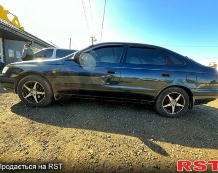 Зеленый Тойота Карина, объемом двигателя 2 л и пробегом 417 тыс. км за 2000 $, фото 2 на Automoto.ua