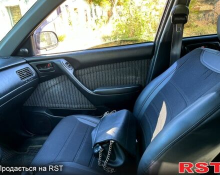 Зеленый Тойота Карина, объемом двигателя 2 л и пробегом 417 тыс. км за 2000 $, фото 6 на Automoto.ua