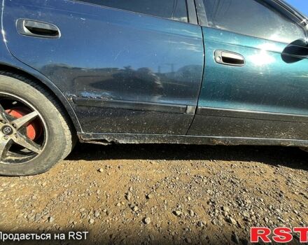 Зеленый Тойота Карина, объемом двигателя 2 л и пробегом 417 тыс. км за 2000 $, фото 1 на Automoto.ua