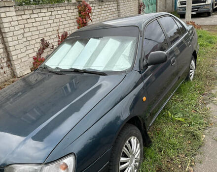 Зеленый Тойота Карина, объемом двигателя 2 л и пробегом 500 тыс. км за 1500 $, фото 2 на Automoto.ua