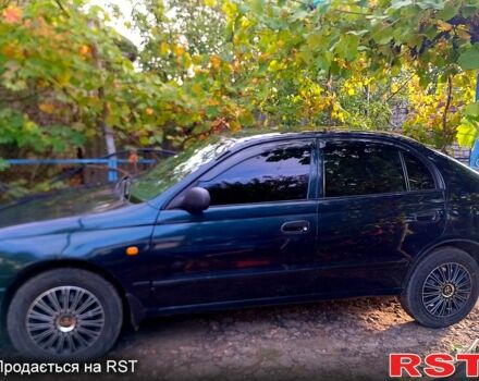 Зелений Тойота Каріна, об'ємом двигуна 1.6 л та пробігом 438 тис. км за 2000 $, фото 5 на Automoto.ua