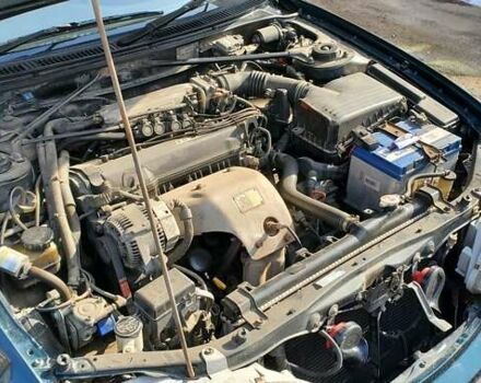 Зеленый Тойота Карина, объемом двигателя 2 л и пробегом 450 тыс. км за 3500 $, фото 1 на Automoto.ua