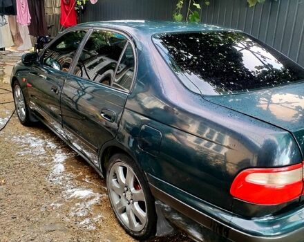 Зеленый Тойота Карина, объемом двигателя 2 л и пробегом 525 тыс. км за 2400 $, фото 1 на Automoto.ua